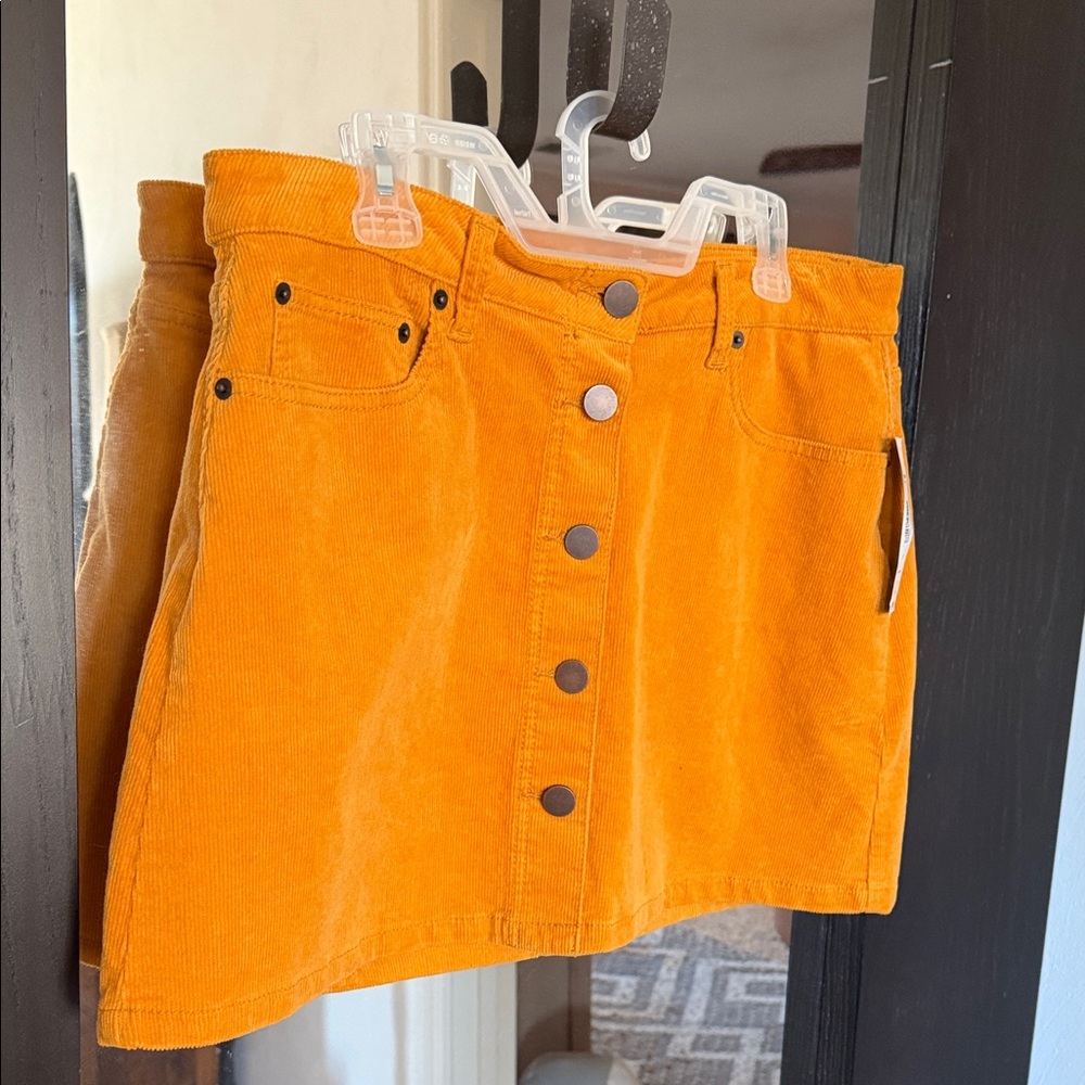 Button-Front Corduroy Mini Skirt in marigold.